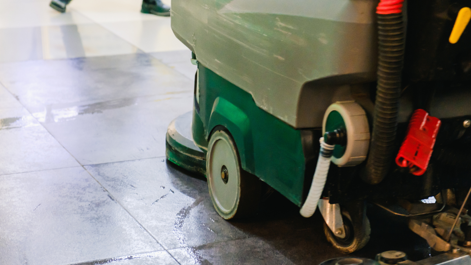 Warehouse cleaner giving a thumbs up