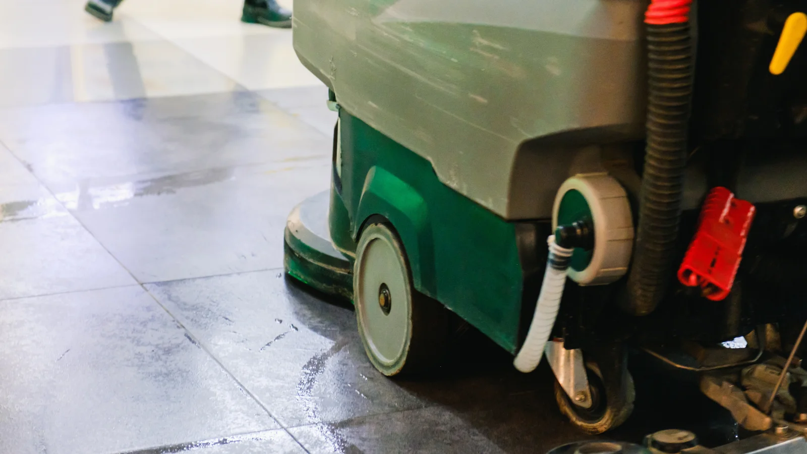 Warehouse cleaner giving a thumbs up